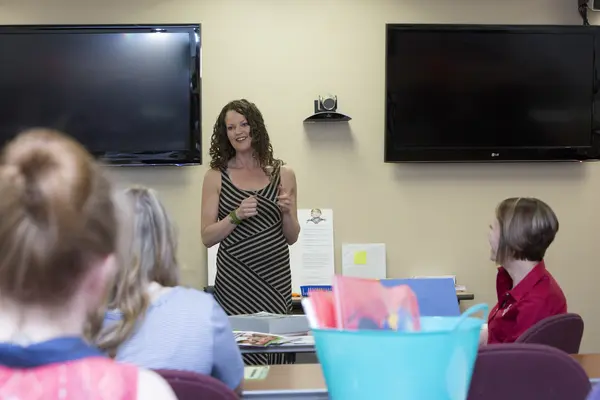 Early childhood instructor with class