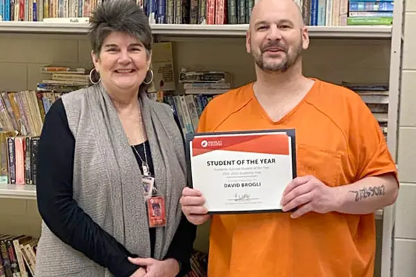 Academic success student award recipient with instructor