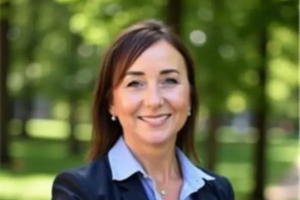 Photo of Vice President Dr. Bobbi Fields outside with green trees in the background