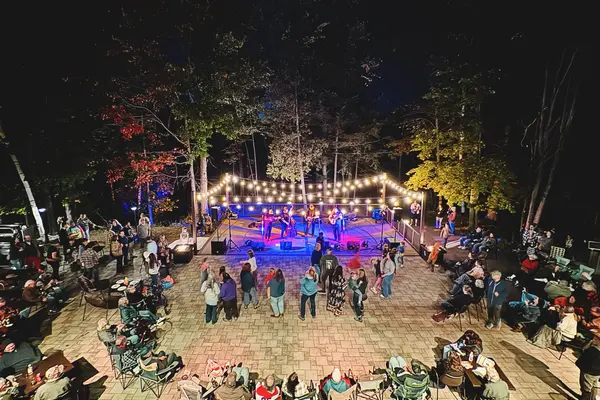 A lively nighttime concert at the Nicolet College Lakeside Patio.