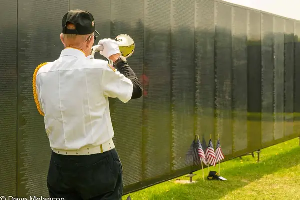 A bugler at the Wall that Heals traveling exhibit at Nicolet College.