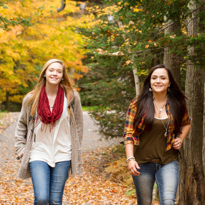High school girls walking on campus in fall