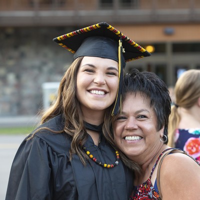 female graduate smiling with mother