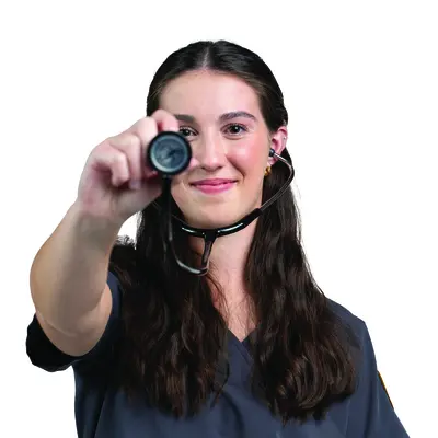 Smiling woman holding a stethoscope toward the camera.