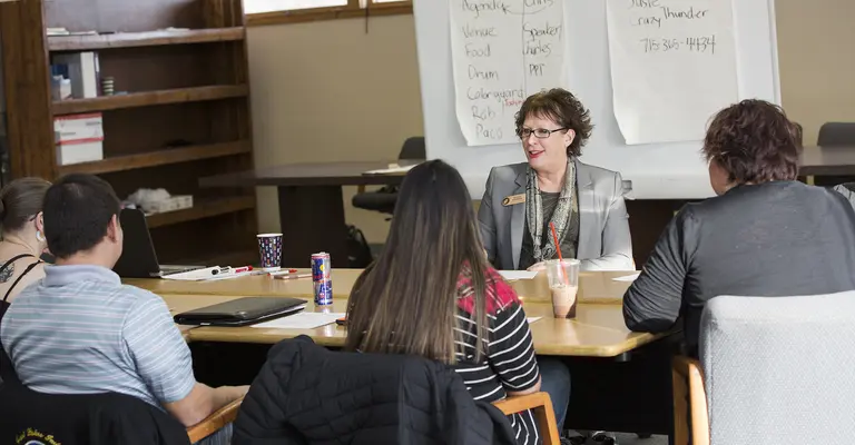 Business Management instructor with class