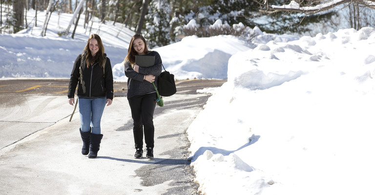 two female students walking to class