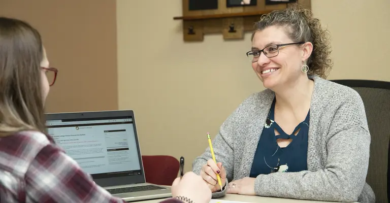Financial Aid Advisor with student