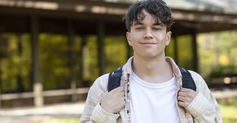 Student in front of building