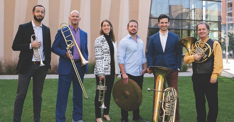 Wisconsin Brass Quintet group photographed with instruments outside