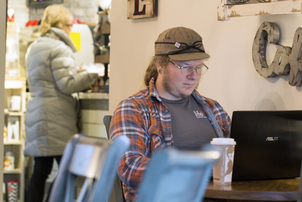 online learner at local coffee shop
