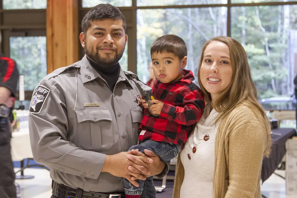 Academy graduate with his family