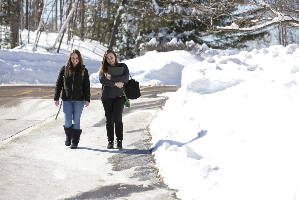 two female students walking to class