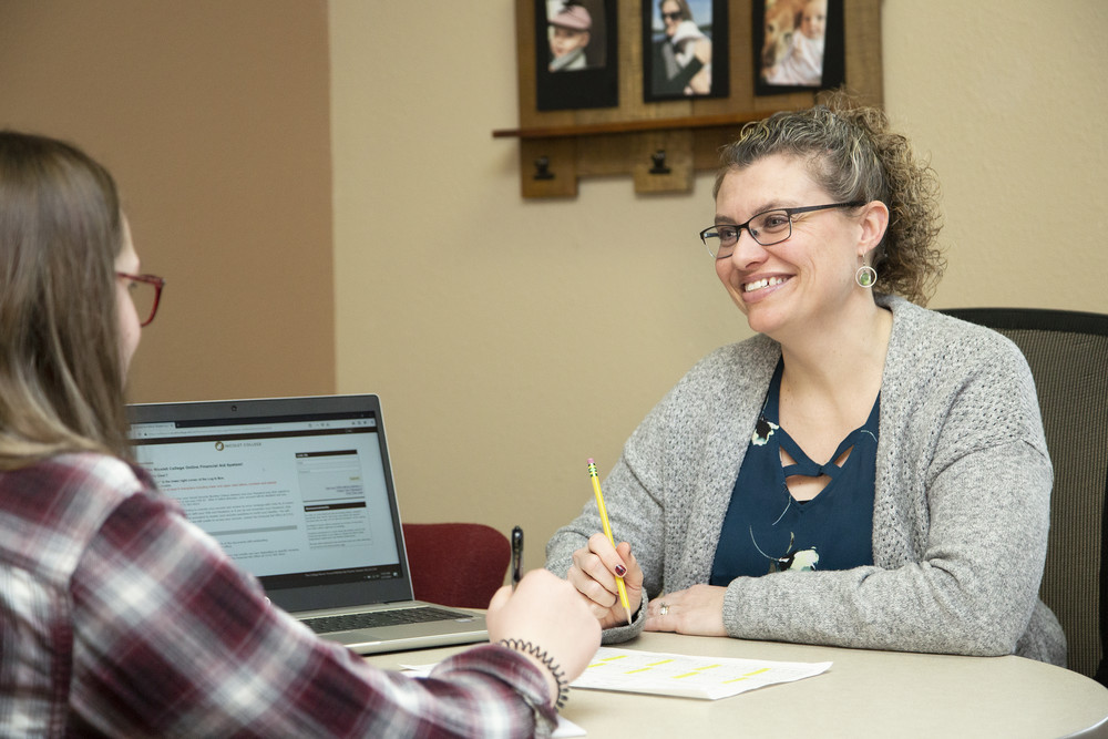 Financial Aid Advisor with student