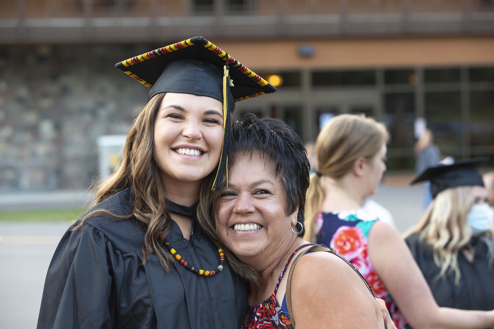 female graduate smiling with mother