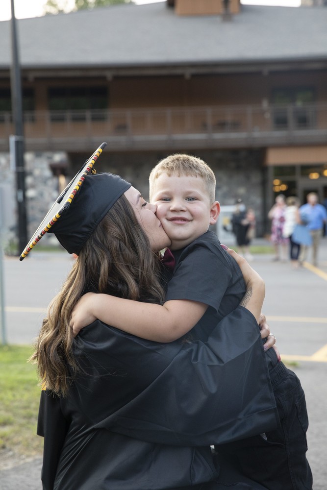 mom graduate with son