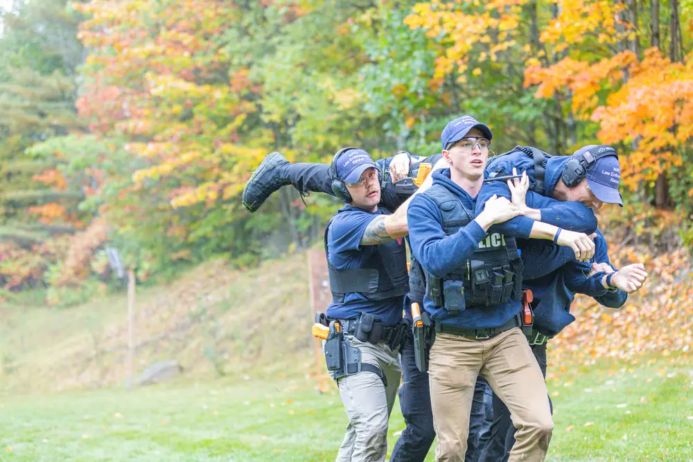 Recruit Academy Students carrying another student for tactical practice