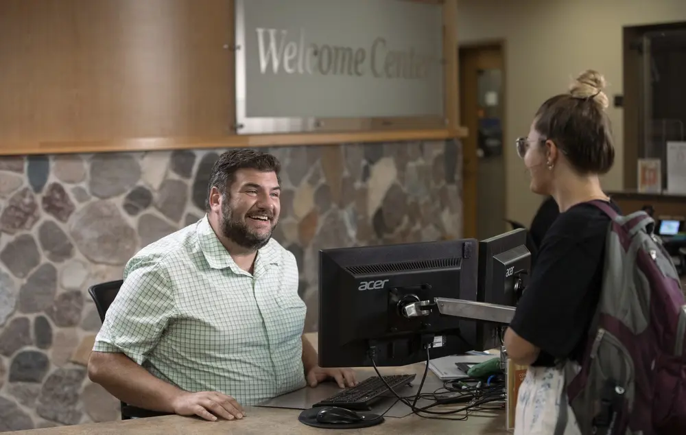 A student getting the help they need at the Nicolet College Welcome Center.