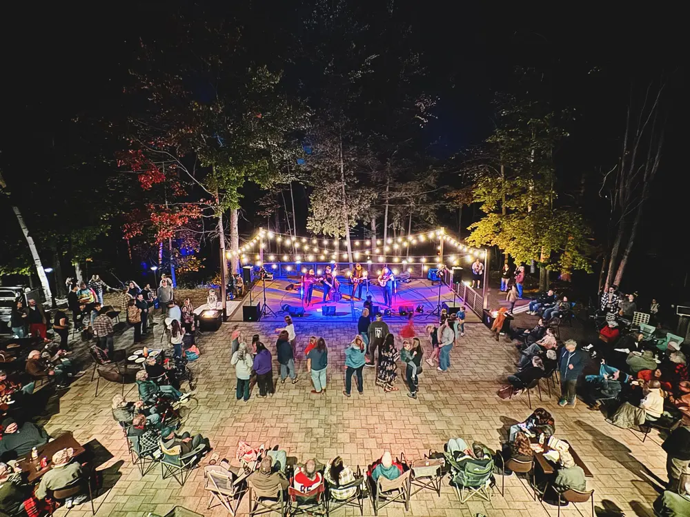 A lively nighttime concert at the Nicolet College Lakeside Patio.