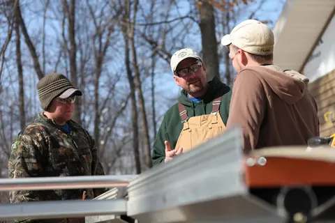 Apprenticeship students working outside with instructor