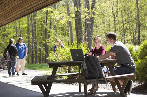 young students at picnic table