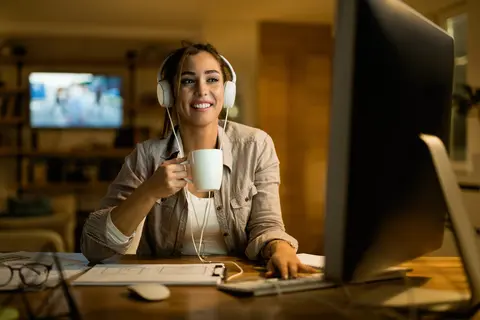 female working or studying from home in kitchen