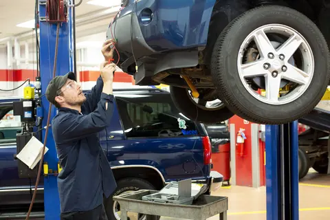 automotive student attaching plug