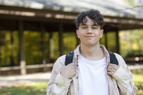 Student in front of building