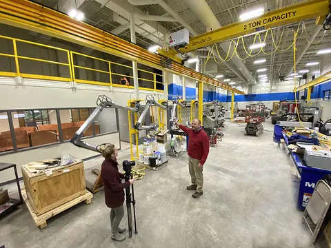 two people standing in a building that is being remodeled