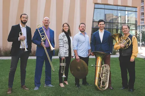 Wisconsin Brass Quintet group photographed with instruments outside