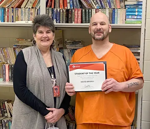 Academic success student award recipient with instructor