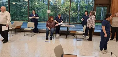 Physical therapists and Nicolet College students perform health assessments with Learning in Retirement members.