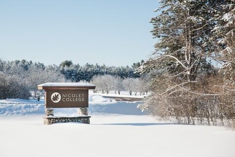 Nicolet College Sign in Winter
