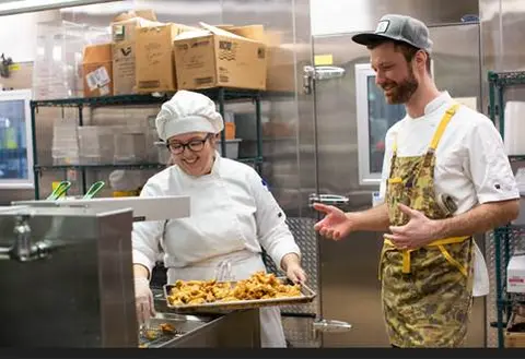 Chef Mitch assisting a female student