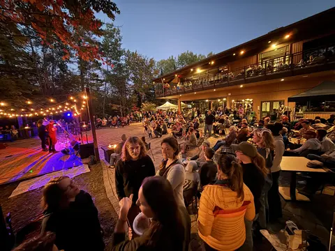 A lively, crowded waterfront patio at Nicolet College.