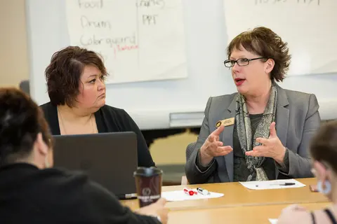 Students and an instructor in a business class.