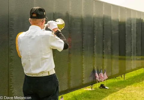 A bugler at the Wall that Heals traveling exhibit at Nicolet College.