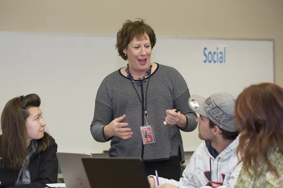 business management instructor teaching in class