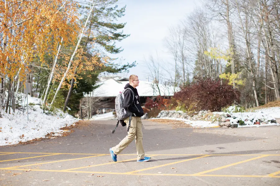 student walking on campus in the winter