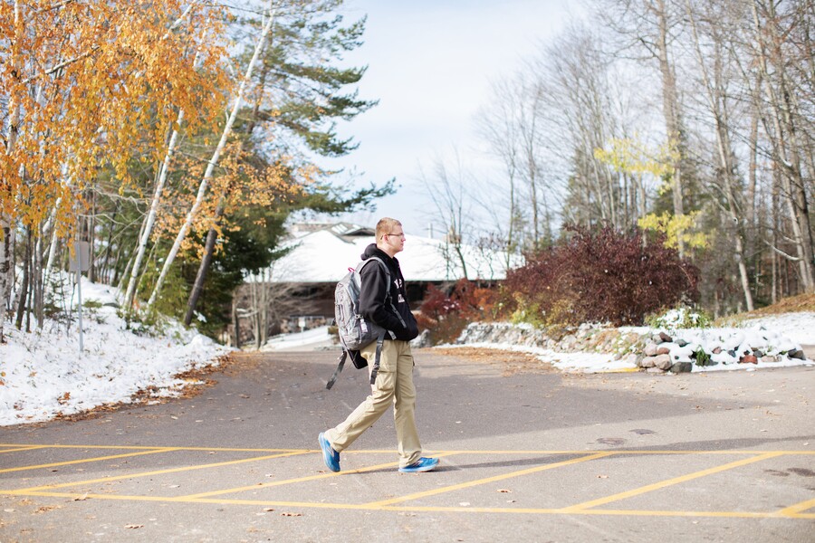 student walking on campus in the winter