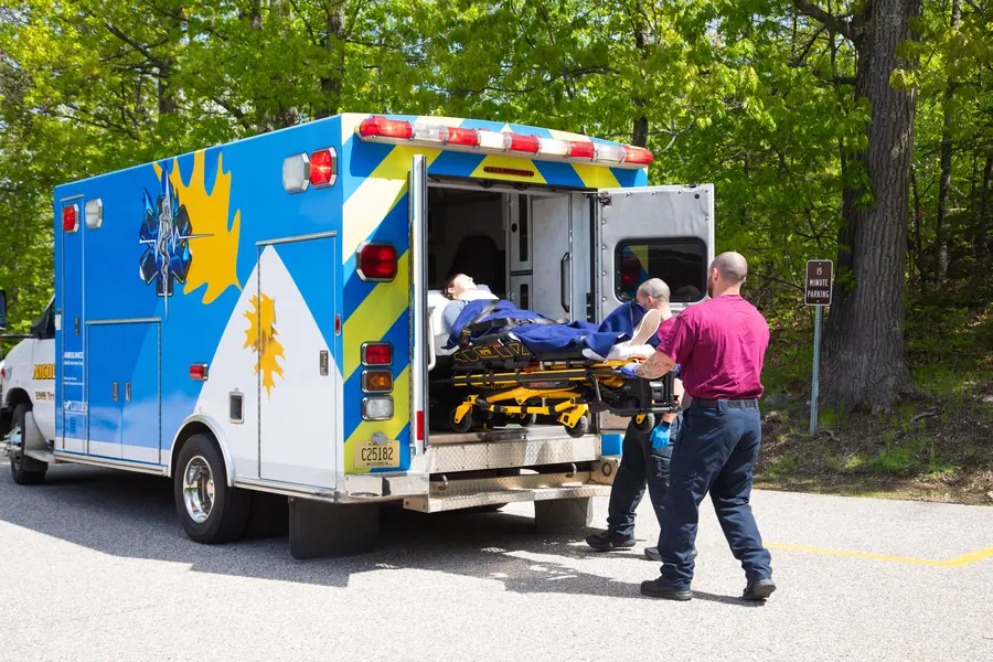 Emergency Response students removing a patient from the ambulance on a stretcher