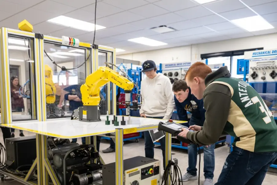 Students in Nicolet College's electromechanical lab.