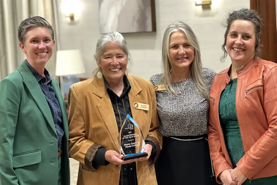 Four smiling women. Layla Merrifield, Dianne Lazear, Kate Ferrel and Abbey Dall Lukowski at the District Board Association banquet.