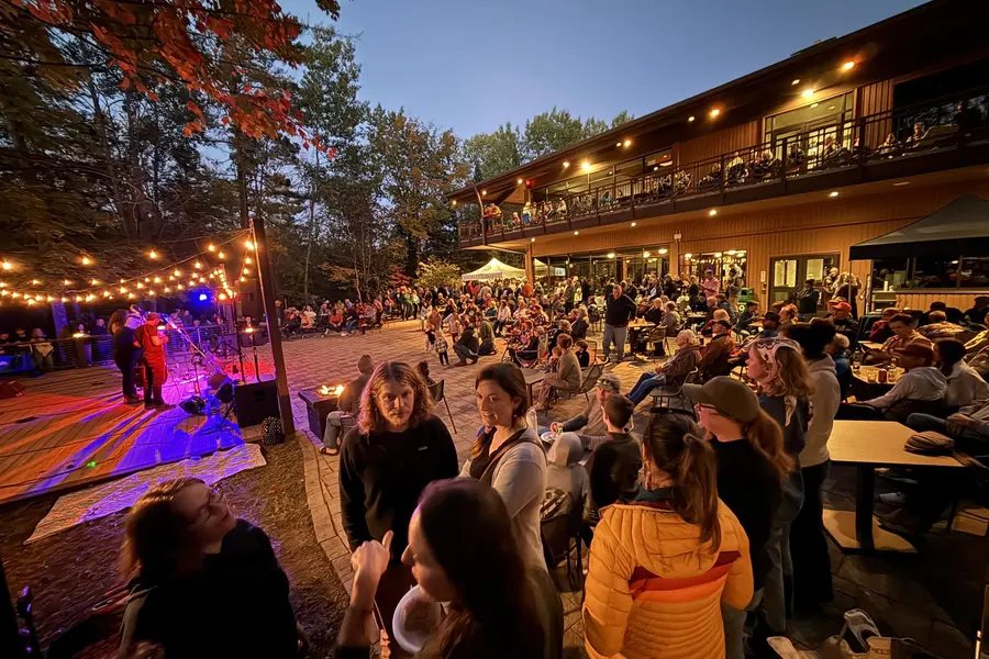 A lively, crowded waterfront patio at Nicolet College.